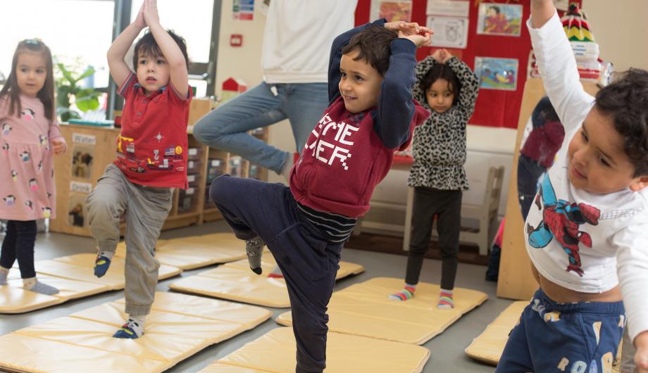 children doing yoga together