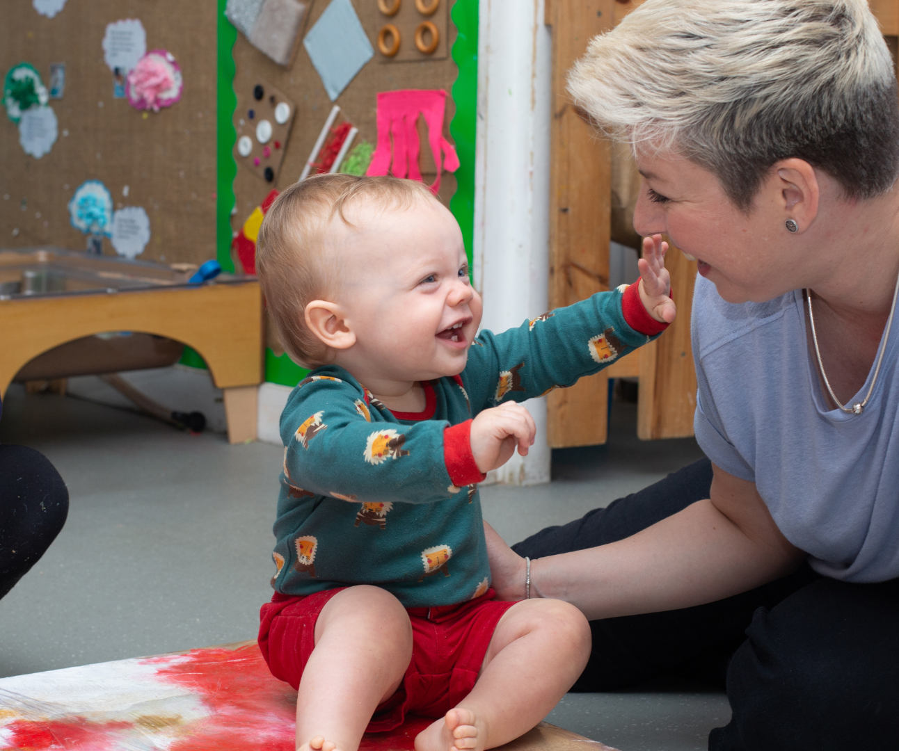 baby laughing at the member of staff