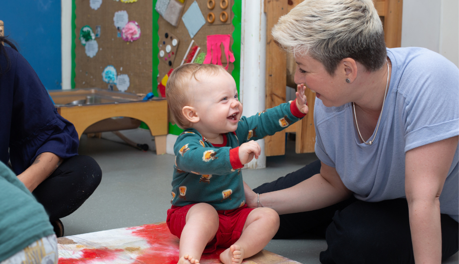 baby laughing at the member of staff