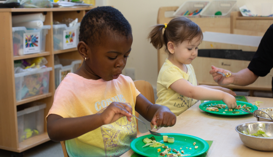 Child eating food with a fork